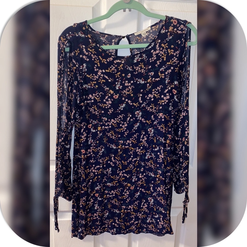 Short flare floral dress with cutout long sleeve and tie detailing on the wrist